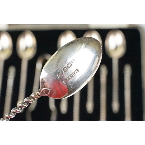 234 - A cased set of twelve fully hallmarked sterling silver teaspoons together with sugar tongs contained... 