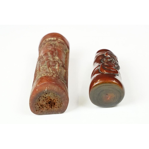 240 - Two oriental Netsuke with decorative animal carvings.