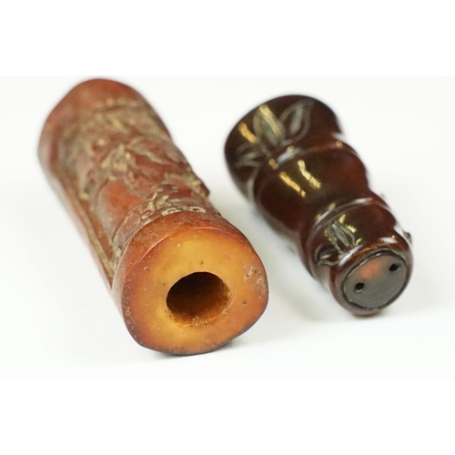 240 - Two oriental Netsuke with decorative animal carvings.