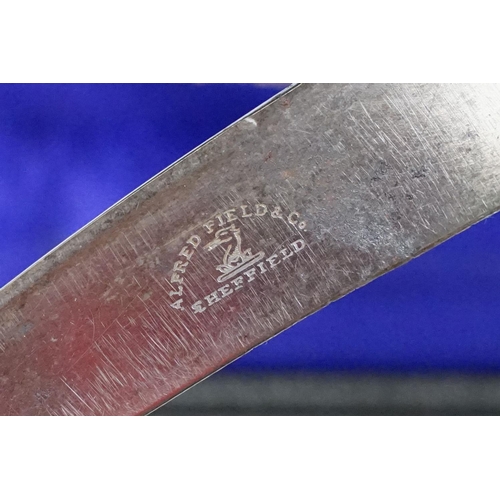 253 - A cased carving set with antler handles and sterling silver mounts.