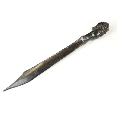 345 - A vintage hand carved ebony letter opener together with a tribal figure and resin buddah with two fr... 