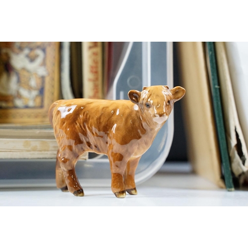 348 - A box of mixed collectables to include ephemera, books, postcards and a Beswick figurine.