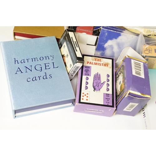 352 - A box of mixed Tarrot card sets together with reading guides.