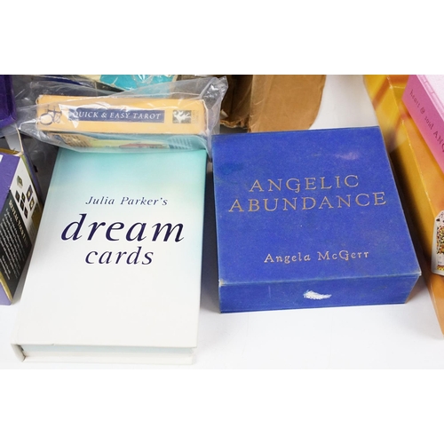 352 - A box of mixed Tarrot card sets together with reading guides.