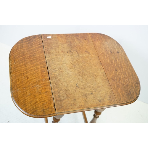 593 - Small oak drop leaf table, with stretchered base, 61cm high x 69cm (extended) wide x 53cm deep