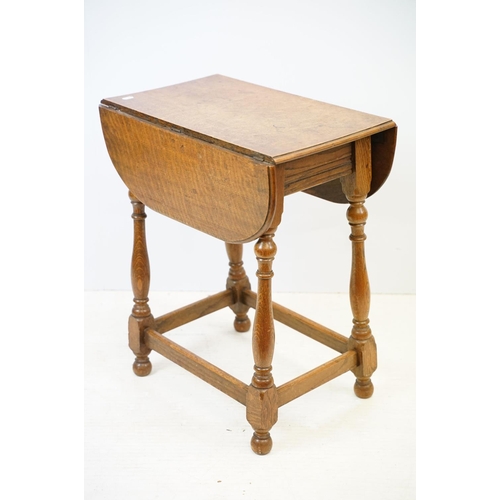 593 - Small oak drop leaf table, with stretchered base, 61cm high x 69cm (extended) wide x 53cm deep