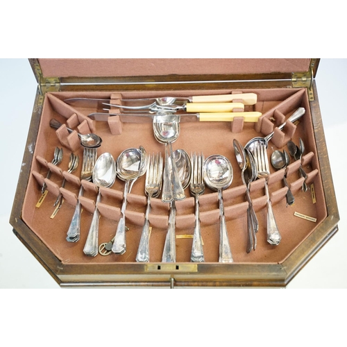 621 - Art Deco style walnut canteen of cutlery, on stretchered stand, containing silver plated flatware, 7... 