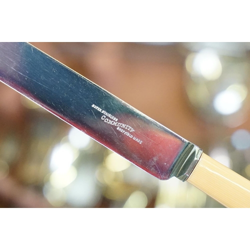 621 - Art Deco style walnut canteen of cutlery, on stretchered stand, containing silver plated flatware, 7... 