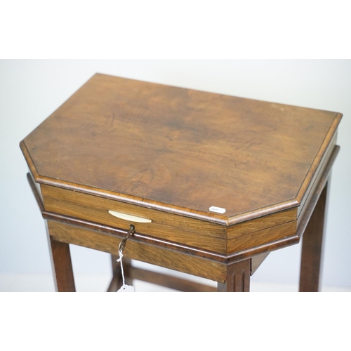 621 - Art Deco style walnut canteen of cutlery, on stretchered stand, containing silver plated flatware, 7... 