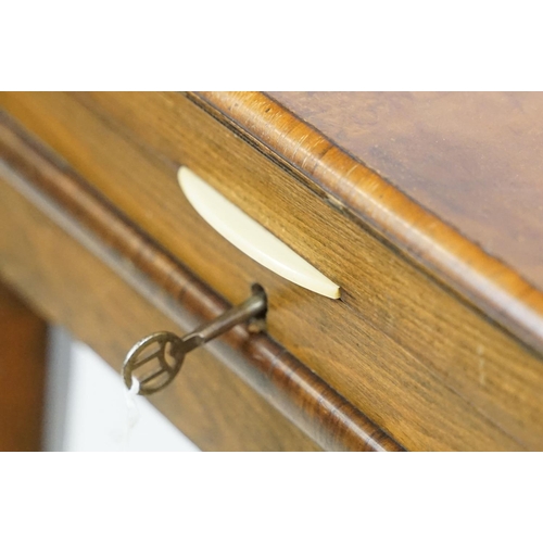 621 - Art Deco style walnut canteen of cutlery, on stretchered stand, containing silver plated flatware, 7... 