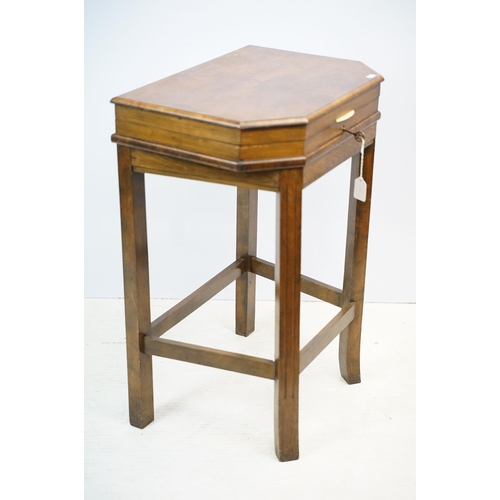 621 - Art Deco style walnut canteen of cutlery, on stretchered stand, containing silver plated flatware, 7... 