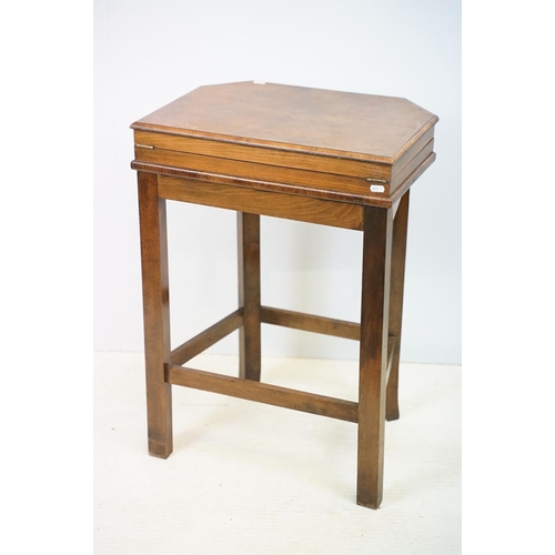 621 - Art Deco style walnut canteen of cutlery, on stretchered stand, containing silver plated flatware, 7... 