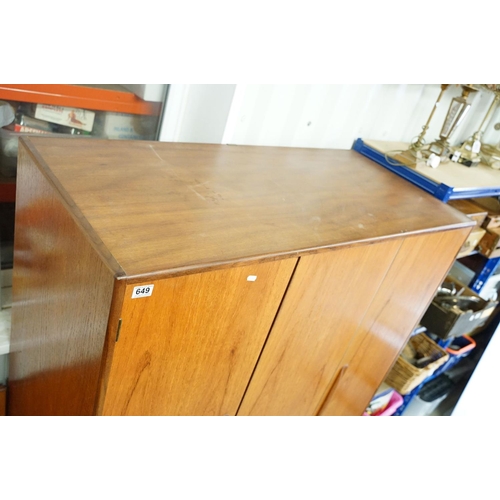 649 - G Plan three door wardrobe, two concertina doors and one further door, maker's label inside, hanging... 