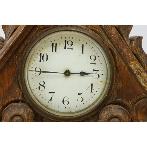 179 - Late 19th / early 20th century wooden ashtray raised on three paw feet, a carved oak mantel clock & ... 