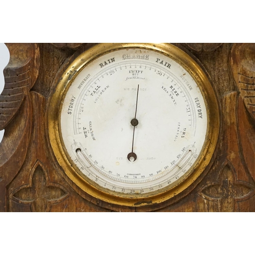 179 - Late 19th / early 20th century wooden ashtray raised on three paw feet, a carved oak mantel clock & ... 