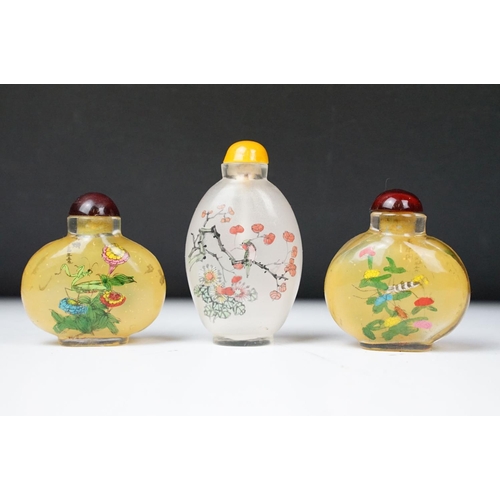 356 - A collection of Chinese scent bottles to include glass and cinibar lacquer examples