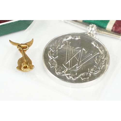 361 - A small group of collectables to include a limited edition ceramic vase, Womens Voluntary Service me... 