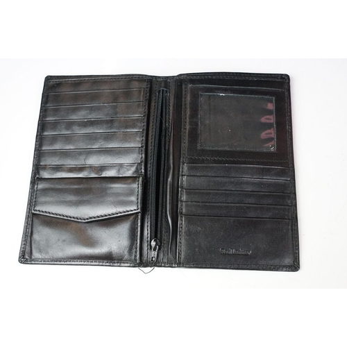 369 - A collection of over forty leather wallets and purses of various sizes and colours.