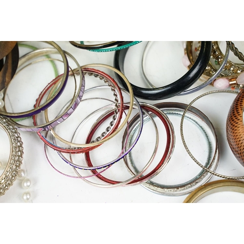371 - A large collection of contemporary ladies cuff bangles.