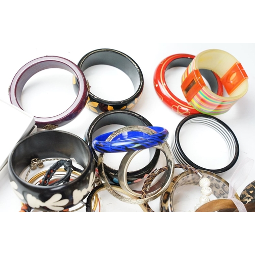 371 - A large collection of contemporary ladies cuff bangles.