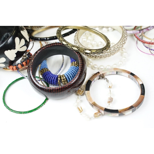 371 - A large collection of contemporary ladies cuff bangles.