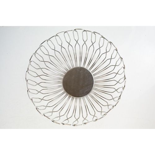 372 - A small Georg Jensen stainless steel bread basket within original box together with three commemorat... 