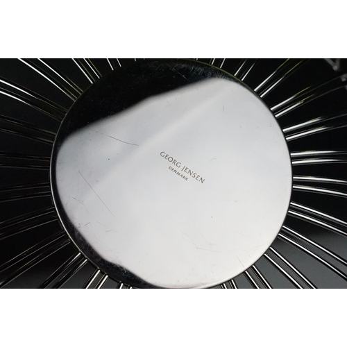 372 - A small Georg Jensen stainless steel bread basket within original box together with three commemorat... 