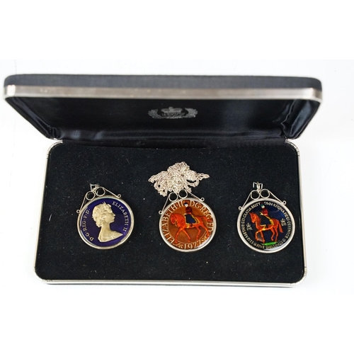 372 - A small Georg Jensen stainless steel bread basket within original box together with three commemorat... 