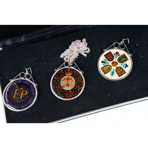 372 - A small Georg Jensen stainless steel bread basket within original box together with three commemorat... 