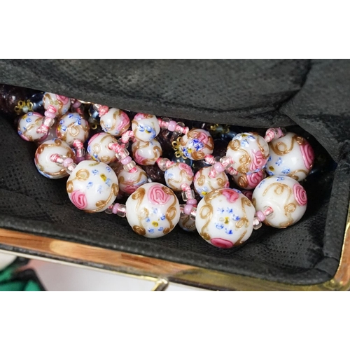 376 - A collection of mainly vintage costume jewellery to include a wedding cake beaded necklace.