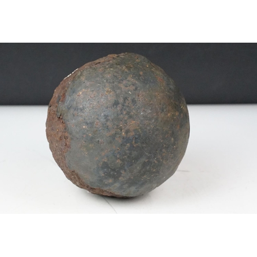 378 - An antique cast iron cannonball