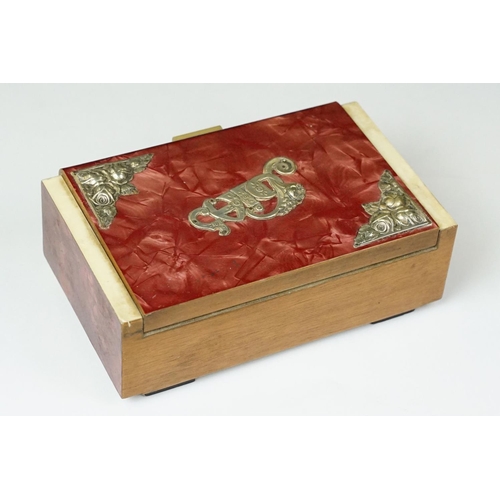 380 - Art Deco celluloid covered Art Deco jewellery box with silk lined interior. Measures 18cm wide.