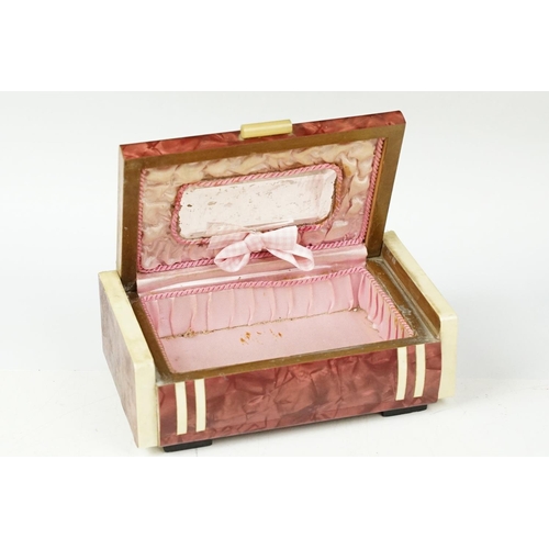 380 - Art Deco celluloid covered Art Deco jewellery box with silk lined interior. Measures 18cm wide.