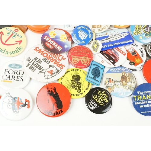 384 - A collection of vintage buttons badges and keyrings to include many advertising examples.
