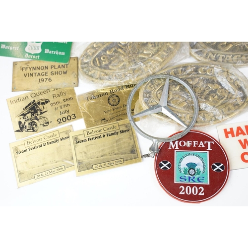 385 - A collection of mixed car badges together with a selection of brass steam rally badges.