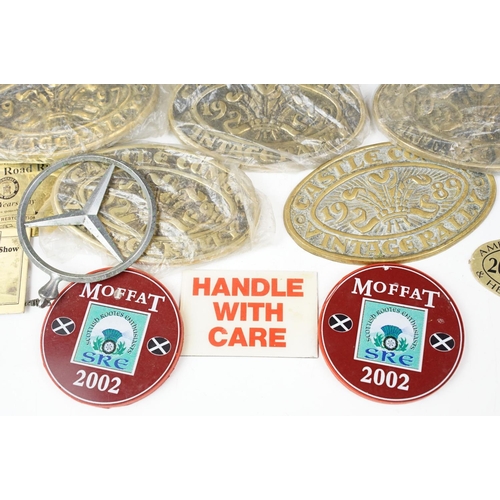 385 - A collection of mixed car badges together with a selection of brass steam rally badges.