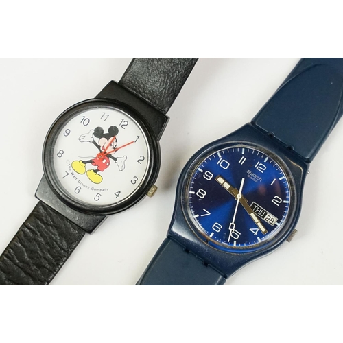 391 - Five Swatch watches together with a Disney company Mickey Mouse watch