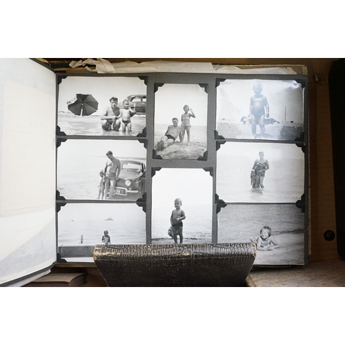 421 - Collection of mostly 1950s black and white photographs covering holidays, weddings and topographical... 