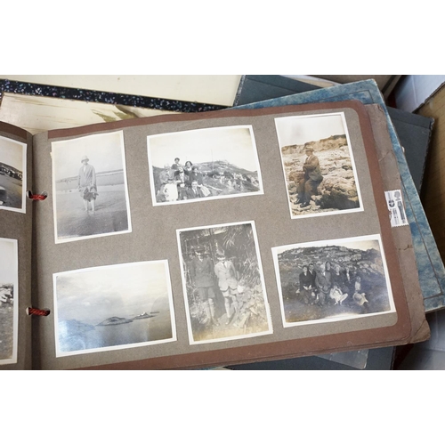 421 - Collection of mostly 1950s black and white photographs covering holidays, weddings and topographical... 