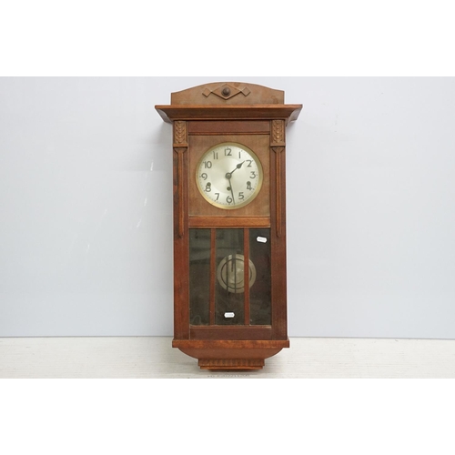 496 - Early 20th century mahogany wall clock, the silvered dial with Arabic numerals, approx 78cm tall