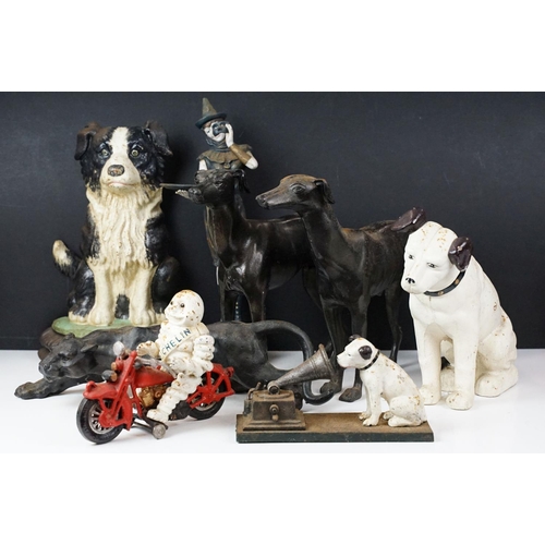 500 - Collection of eight cast iron figures to include a pair of Greyhound ornaments, Panther, Michelin Ma... 