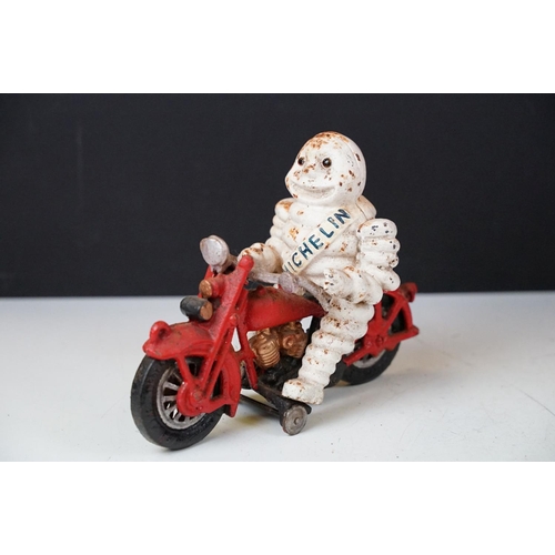 500 - Collection of eight cast iron figures to include a pair of Greyhound ornaments, Panther, Michelin Ma... 