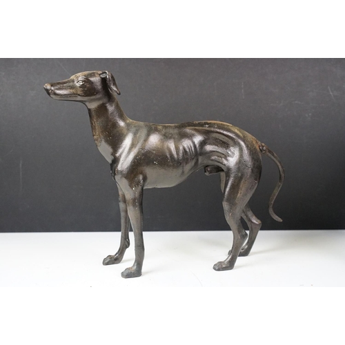 500 - Collection of eight cast iron figures to include a pair of Greyhound ornaments, Panther, Michelin Ma... 