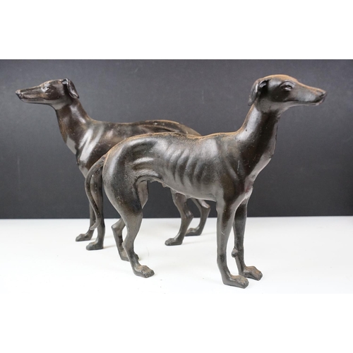 500 - Collection of eight cast iron figures to include a pair of Greyhound ornaments, Panther, Michelin Ma... 