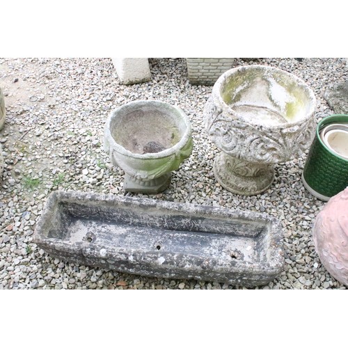 528 - Stone garden trough (approx 90cm long), together with two reconstituted stone footed planters