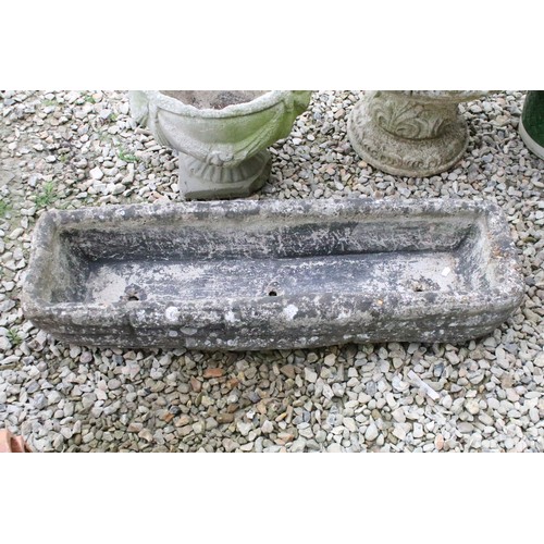 528 - Stone garden trough (approx 90cm long), together with two reconstituted stone footed planters