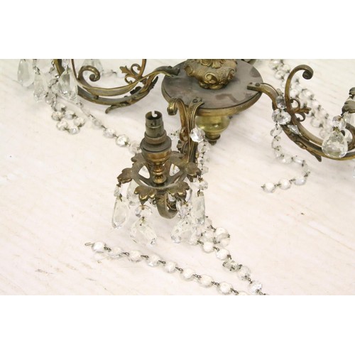 187 - Continental brass four branch electrolier, the green glass body decorated in gold, with oval porcela... 