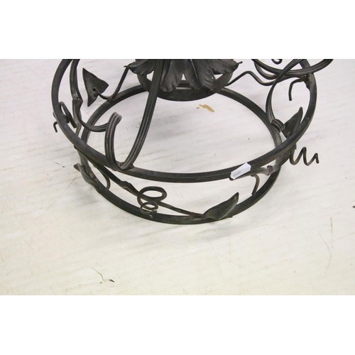 187 - Continental brass four branch electrolier, the green glass body decorated in gold, with oval porcela... 