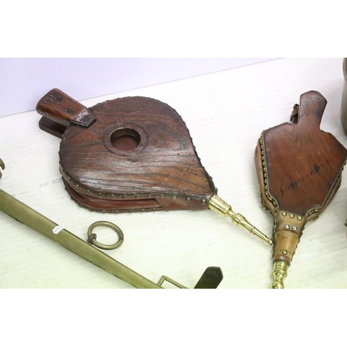 454 - Two Victorian wooden fire bellows together with a Victorian copper kettle, a pair of brass horse ham... 