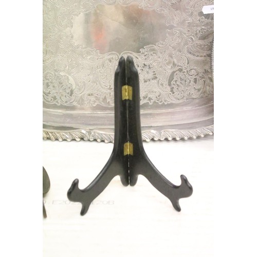 511 - Silver plated twin-handled tray, 61cm long, a silver plated circular tray, two silver plated pepper ... 